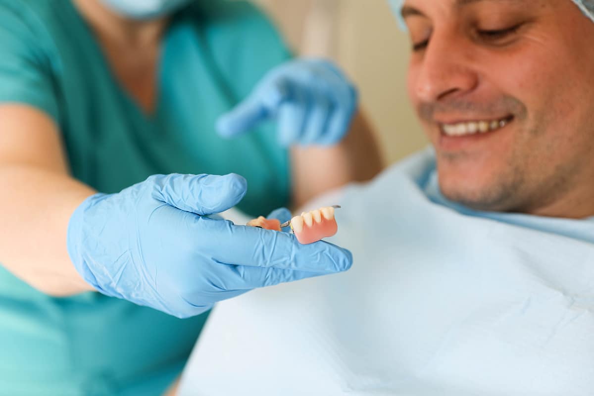 Implant fixed teeth vs removable implant dentures blog