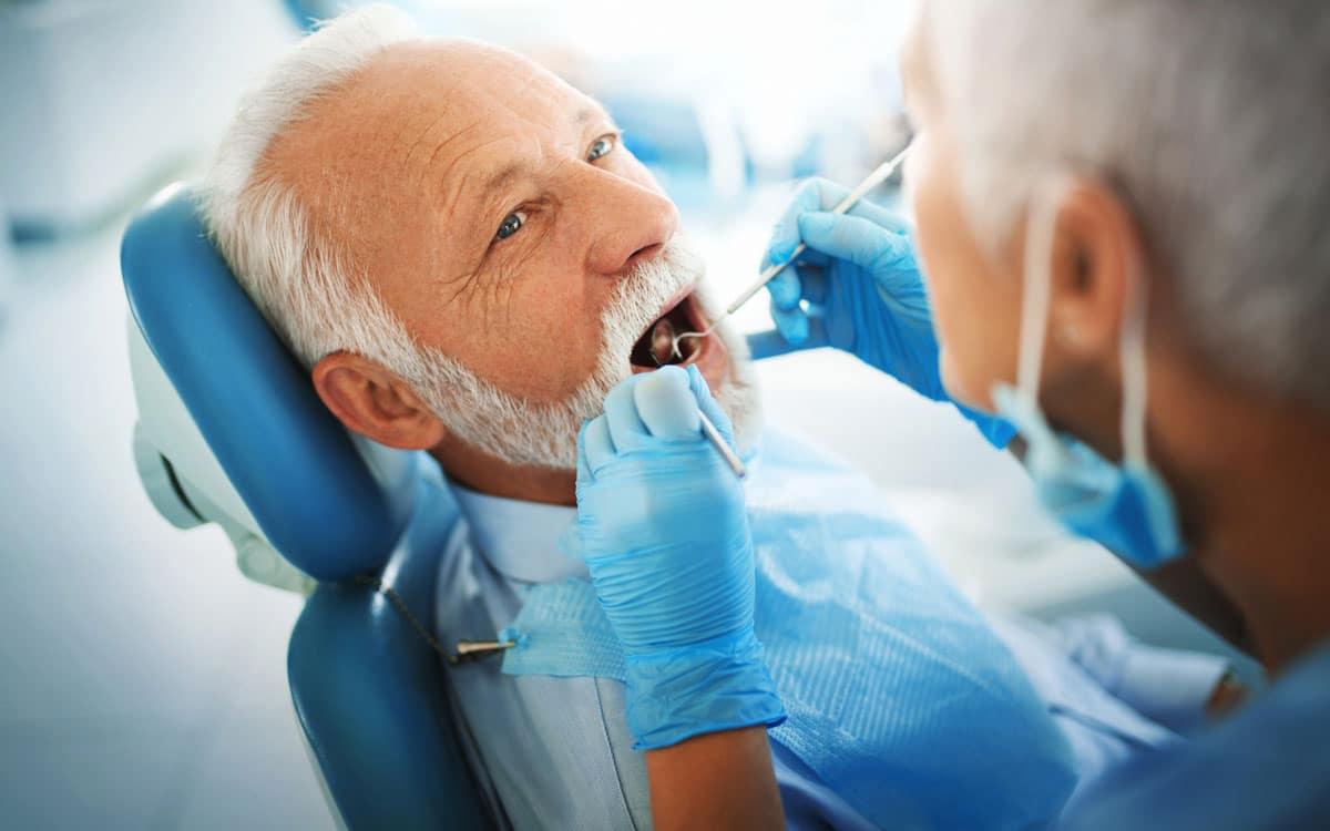 Mature man in dental chair finding a prosthodontist.jpg