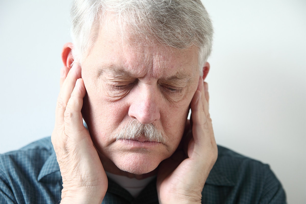 Old man having tmj pain image
